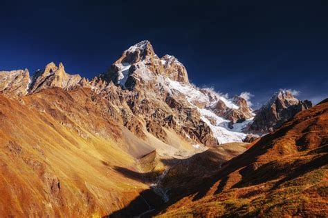 Fantastic Scenery And Snowy Peaks In The First Morning Sunlight Stock