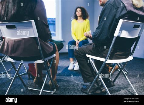 Large Group Of People Having A Counseling Session Stock Photo Alamy