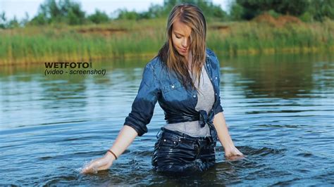 Wetlook By Smiling Girl In Wet Tight Jeans And Gray T Shirt Without Bra In The Lake