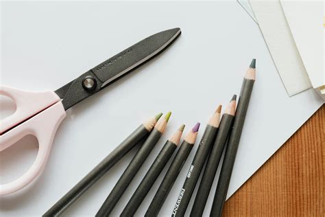 Close Up Photo Of Scissors Beside Coloring Pencils · Free Stock Photo