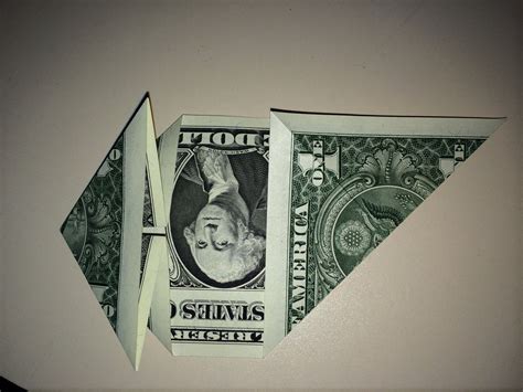Dollar Origami Heart Holding Quarter 11 Steps Instructables