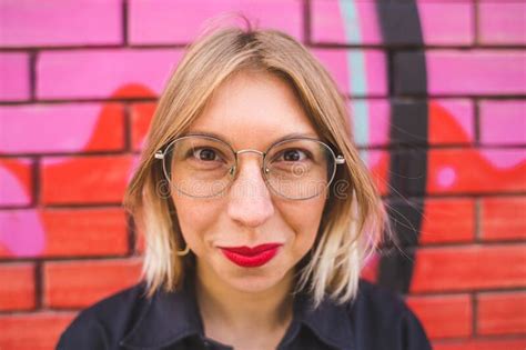 Portrait Of A Blonde In Glasses On A Brick Wall Background Stock Image Image Of Female City