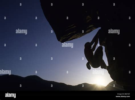 Silhouette Of Rock Climber Stock Photo Alamy