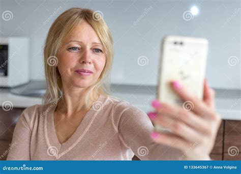middle age woman taking a selfie at home stock image image of home house 133645367