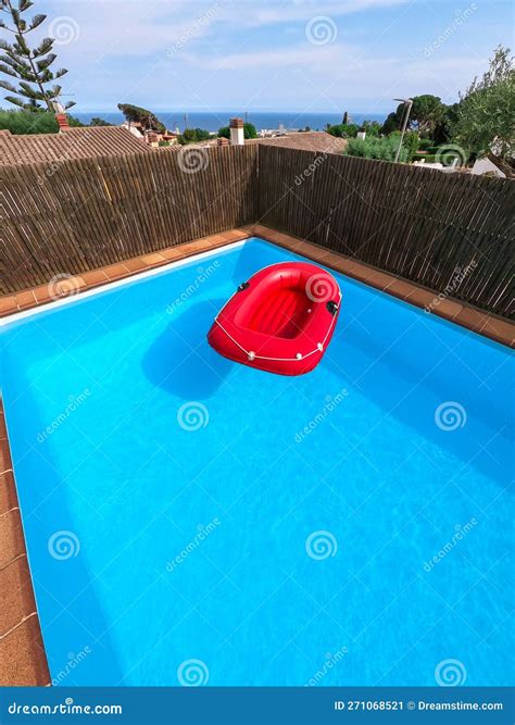 Red Inflatable Boat Floating In A Private Swimming Pool No People Stock Image Image Of