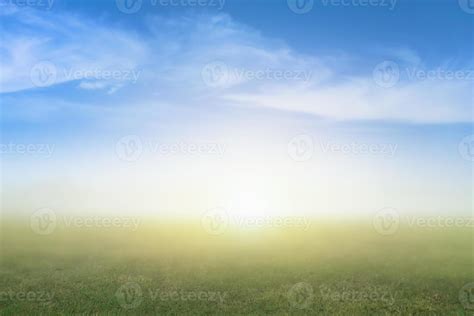 Blurred Nature Background Image Of Blur Green Grass And Blue Sky