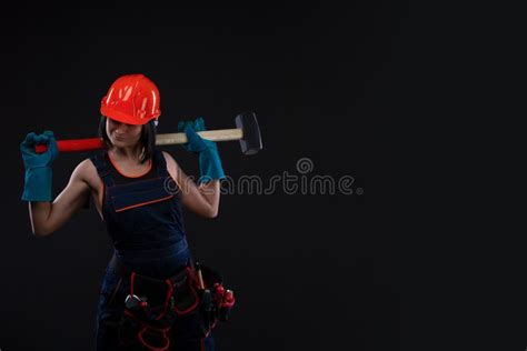 sex equality and feminism girl in safety helmet holding hammer tool attractive woman working