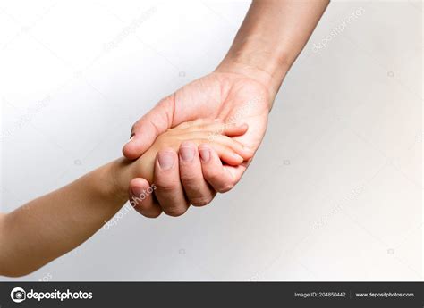 Close Womans Hand Holding Childs Hand Stock Photo By ©iluminada57