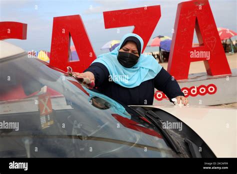 The First Female Palestinian Taxi Driver In The Gaza Strip Nayla Abu Jubbah 39 Sits At Her