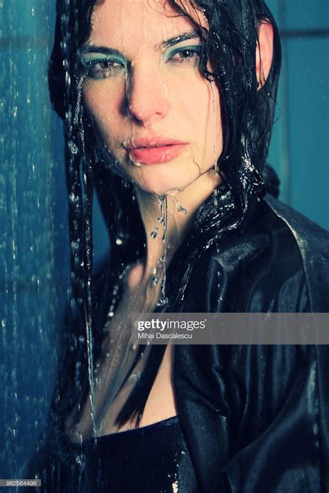 portrait of woman wearing wet clothes in shower bucharest romania portrait banque image