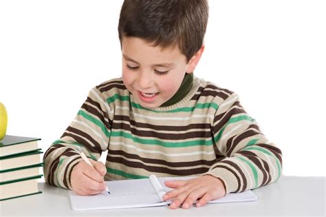Adorable Enfant écrit à Lécole Sur Un Fond Blanc Télécharger Des
