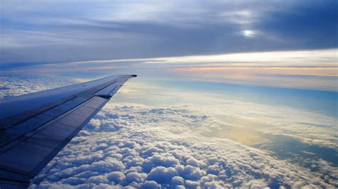 Download Wallpaper 1600x900 Sky Altitude Clouds Airplane Wing