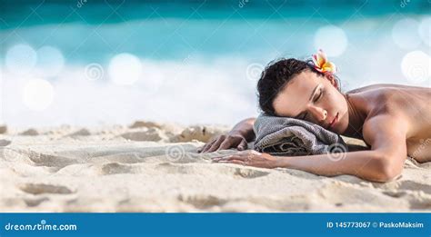 Beautiful Girl Lying Down Under The Sun Tanning In A Tropical Beach Stock Image Image Of