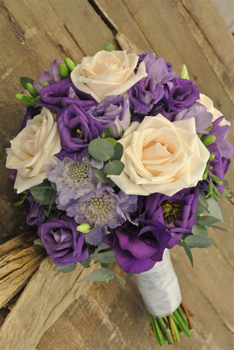 Luscious and lovely, the peony is one of nature's most enchanting flowers. Purple bridal bouquet with roses,lisianthus, scabiosa ...