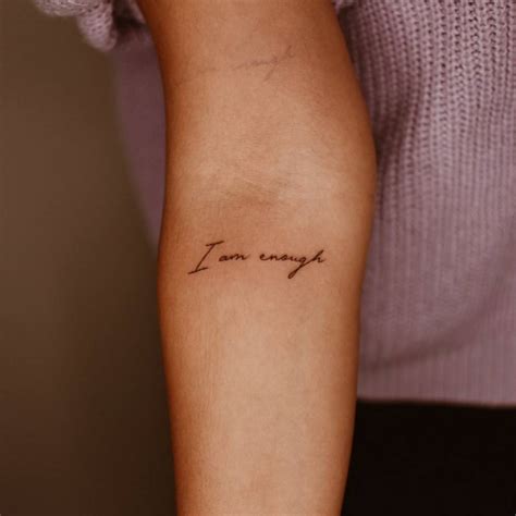 I Am Enough Lettering Tattoo On The Inner Forearm