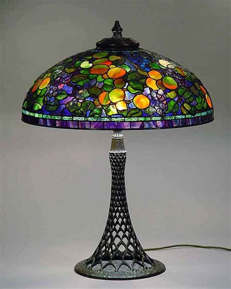 Many of the designs feature flowers, for which the brilliantly colored art glass is perfect, especially when the lamp is lit. Leaded Glass and Bronze table lamp 24" Fruit # 1519 Design ...