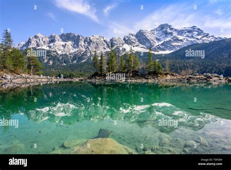 Zugspitze Mountain In Turquoise Lake Eibsee With Reflections Garmisch