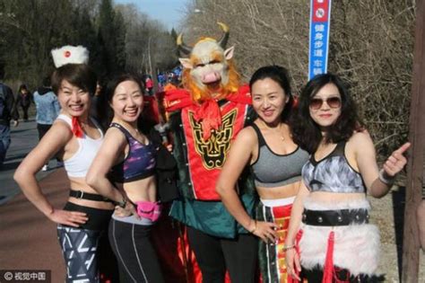 bikini clad participant becomes centre of attention at beijing s annual naked run