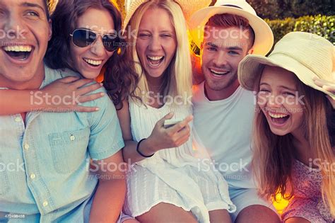 Group Of Young People Having Fun Together Stock Photo Download Image