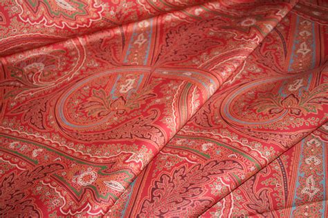 A gorgeously traditional paisley floral home decor fabric with pops of reddish pink among beige and tan. Ralph Lauren Design Fayette Paisley Currant Home Decor Fabric