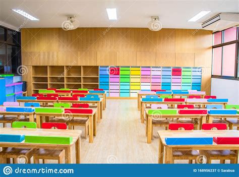 Interior Of Kindergarten Classroom Consist Desks And Chairs Stock Image