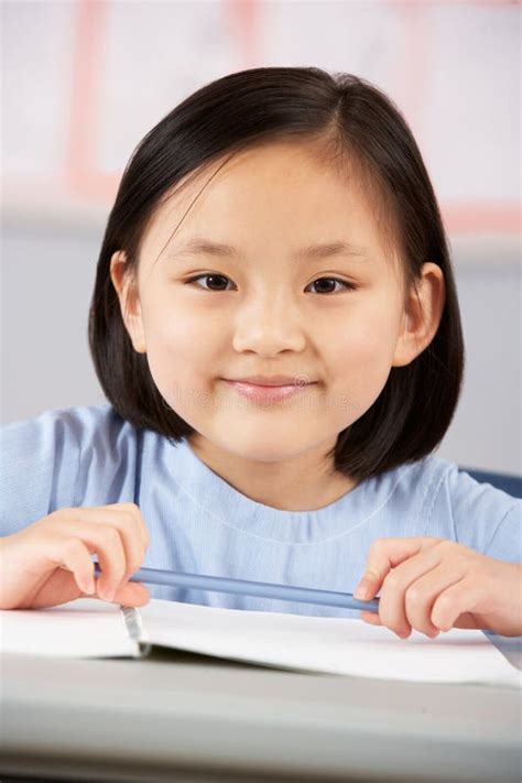 Female Student Working At Desk In School Stock Image Image Of Sitting