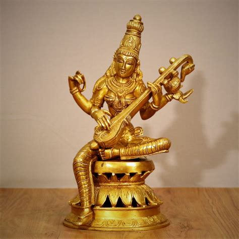 Golden Maa Saraswati Brass Statue Buy Exclusive Brass Statues Collectibles And Decor