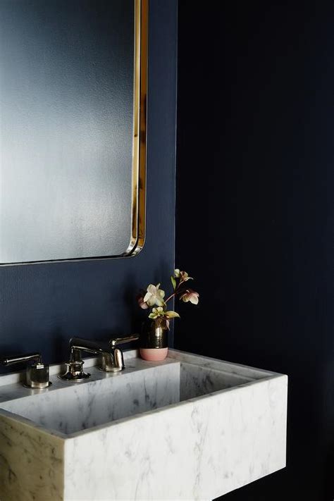 Navy Blue Powder Room With Marble Vanity And Gold Sink Contemporary