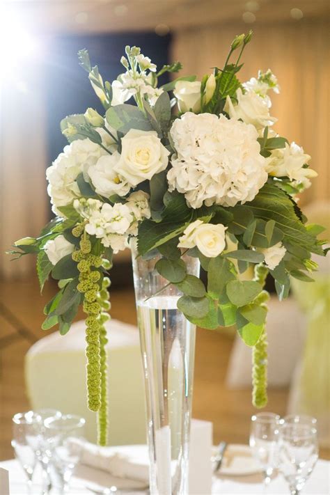 Get inspiration from these wedding centerpiece ideas to see what color palette, style and designs speak to you. Trailing floral simple white wedding table flower ...