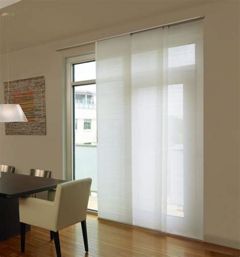This specially designed panel track system also features a cordless wand control to smoothly open and close your blinds. Levolor® Panel Track Blinds: Light Filtering | Sliding glass door window treatments, Sliding ...