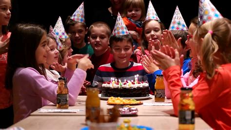 Kids Birthday Party In Playroom Blowing Candles Stock Video Footage