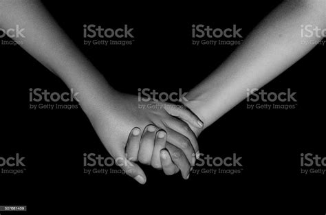 Brother And Sister Holding Hands Isolated On Black Background Stock