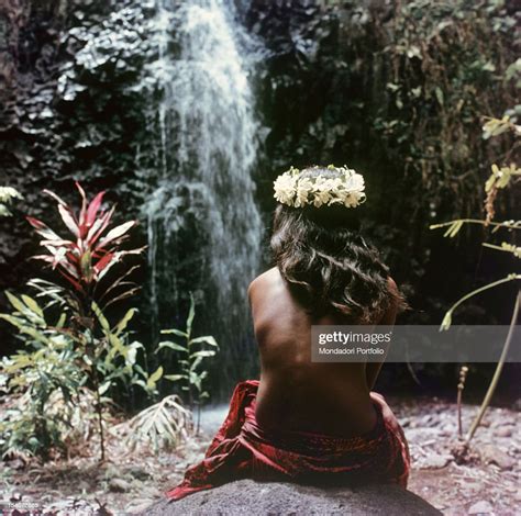 Vahine Tahitian Girl Wearing A Crown Of Flowers Tiare Head Sits On A