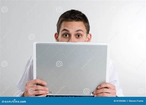 Young Man Peeking Over Laptop Computer Stock Photo Image Of Holds