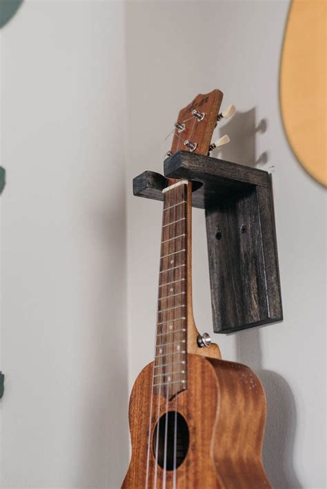 Align the top corners of the rests with the … DIY Wall Mount Guitar Holder | Guitar wall hanger, Diy ...