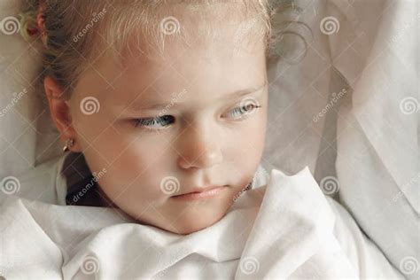 Portrait Of Cute Adorable Smiling Little Girl Waking Up In Her Bed