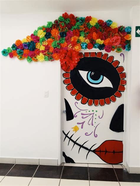 A Door Decorated With Paper Flowers And An Eye
