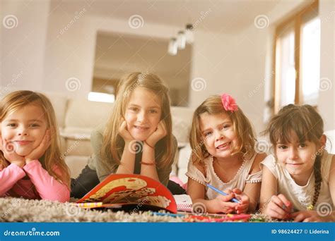 Four Girls Lying On The Floor Stock Image Image Of Child Drawing