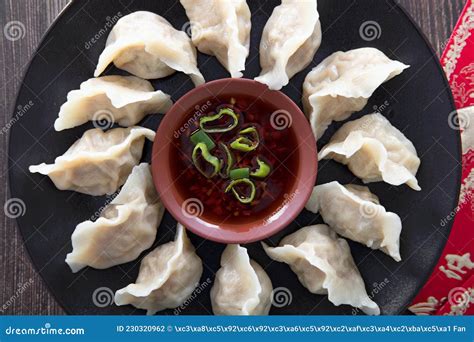 A Plate Of Dumplings And Red Packets Stock Photo Image Of Food Still