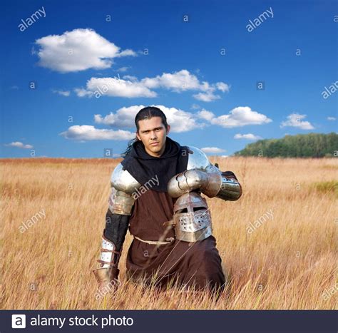 Medieval Knight In The Field With An Axe Stock Photo Alamy