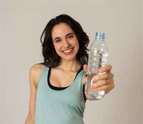 Healthy Attractive Sport Woman Holding And Drinking Water Bottle In