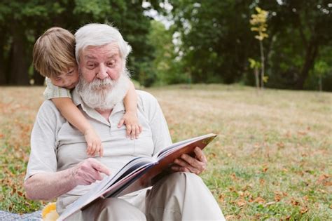 Front View Grandpa Reading For Grandson Photo Free Download
