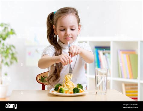 Kid Eating Healthy Food At Home Stock Photo Alamy