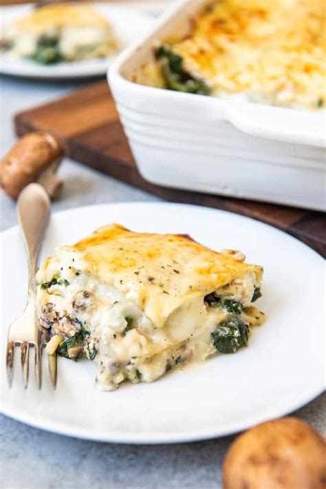 Spray a deep 13x 9 lasagna pan with cooking spray. An image of a slice of chicken spinach lasagna made with a ...