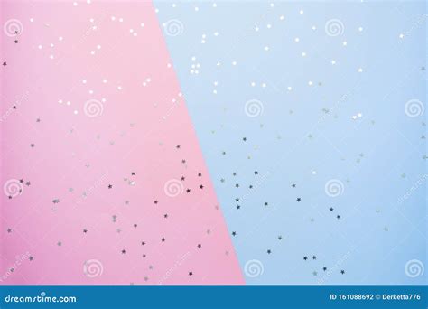 Confetti Of Gold Stars Glisten On A Pink Blue Background Festive