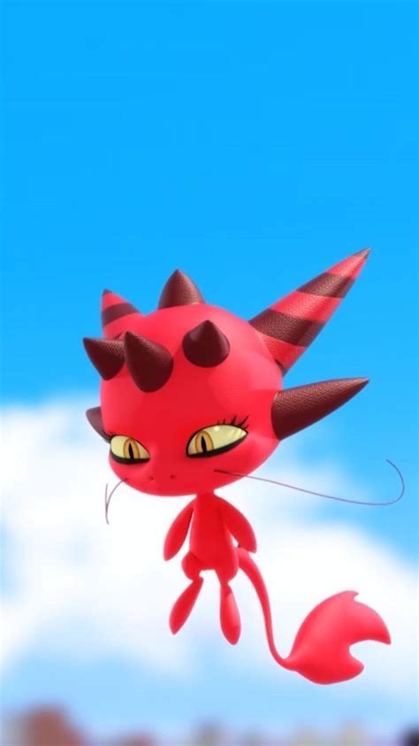A Red Cat Flying Through The Air With Yellow Eyes And Horns On Its Head