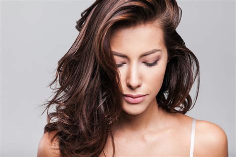Close Up Portrait Of Beautiful Woman Looking Down Viviscal Healthy Hair
