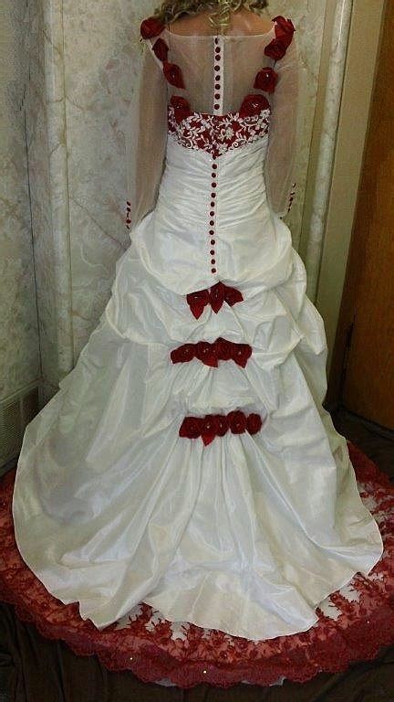 White Wedding Gown With Red Roses