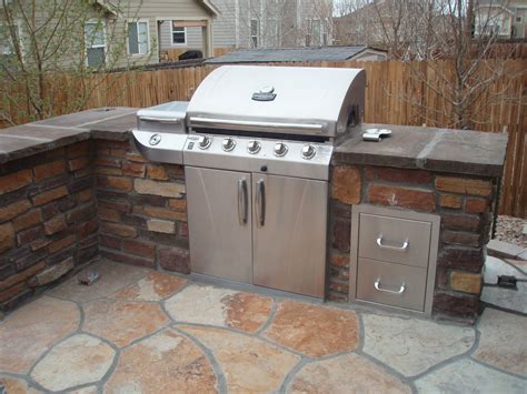 An outdoor kitchen is a valuable amenity for any property, but not every space is conducive to every type of grill. Can build a wall around the grill to give you an outdoor ...