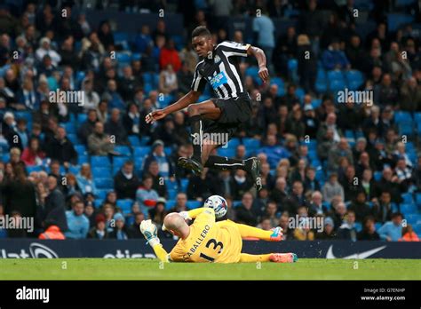 newcastle united s sammy ameobi hurdles a challenge from manchester